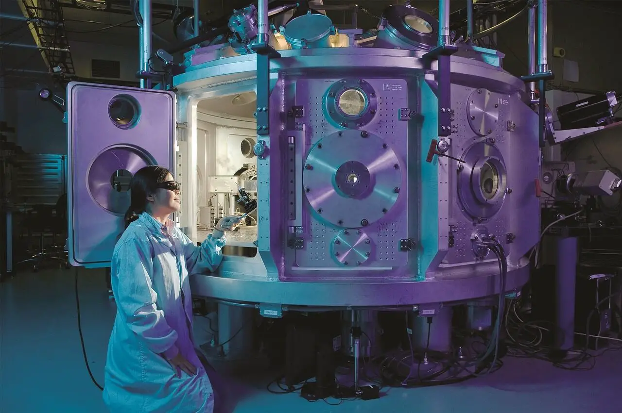 A young woman sitting on her knees, looking inside a big space-lab construction.